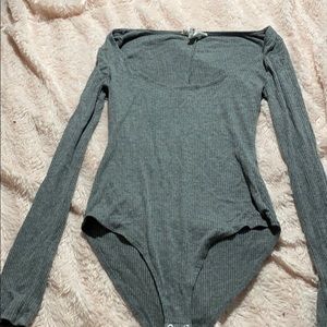 a grey fitted body suit